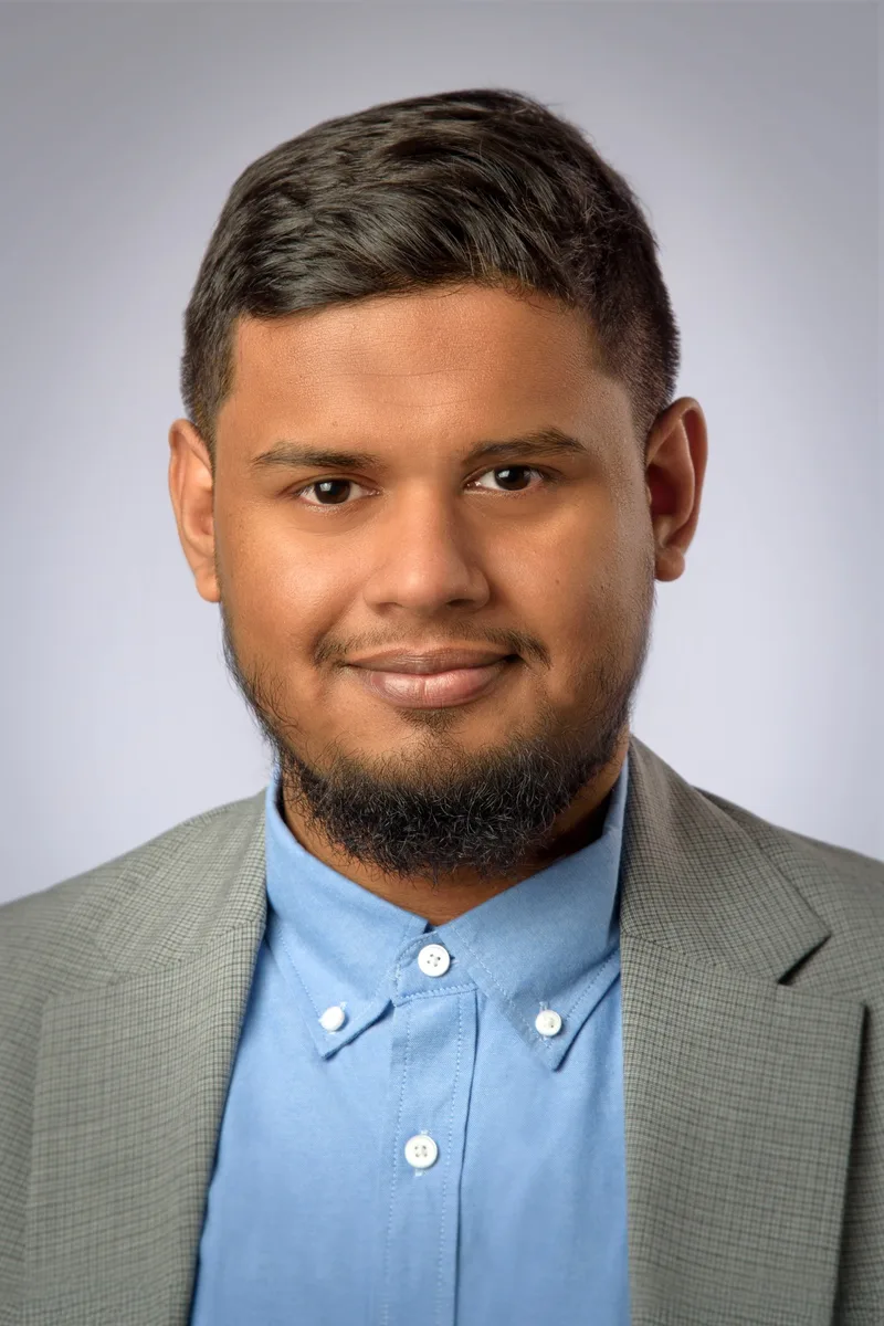 Portrait of A K M Shoriful Islam Sadi, founder of Nabik AI, in a grey jacket and blue shirt